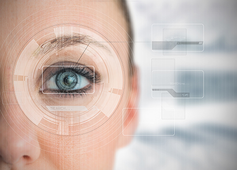 Close up of woman blue eye analyzing chart interfaces